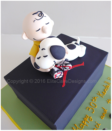 Kids birthday cake of Charlie Brown and Snoopy on a Michael Jordan Nike shoe box